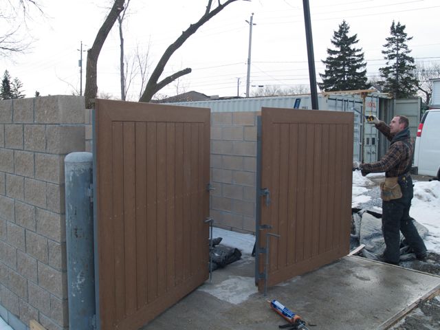 doors get finished on garbage containment area