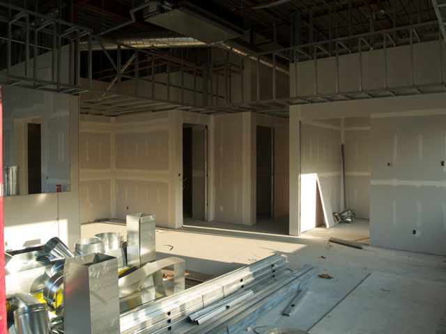 view of office, tech washroom and hallway doors from tech support area