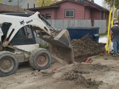 filling in on top of buried conduit